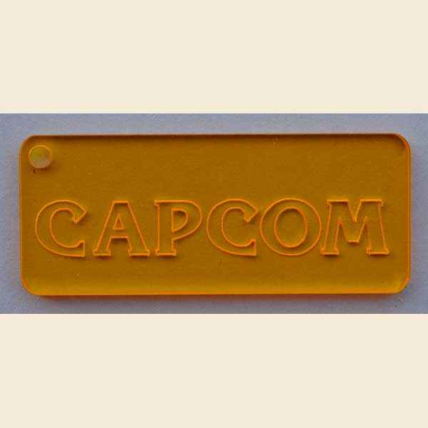 Schlüsselanhänger 'Capcom' rechteckig - gelb